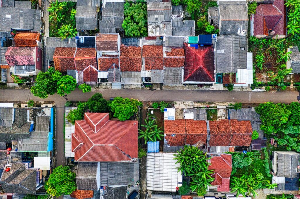 A colorful aerial shot of residential houses with lush greenery in Banten, Indonesia.